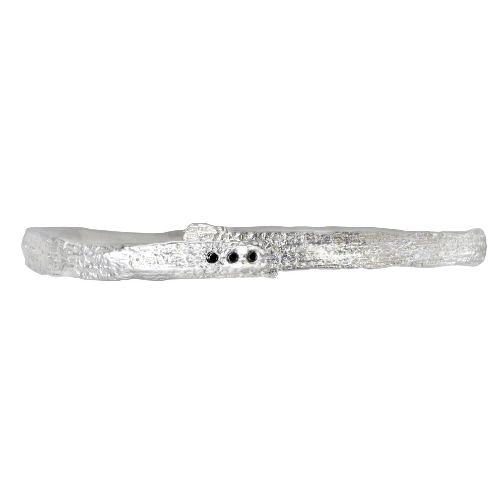 the rattan bangle with three black diamonds