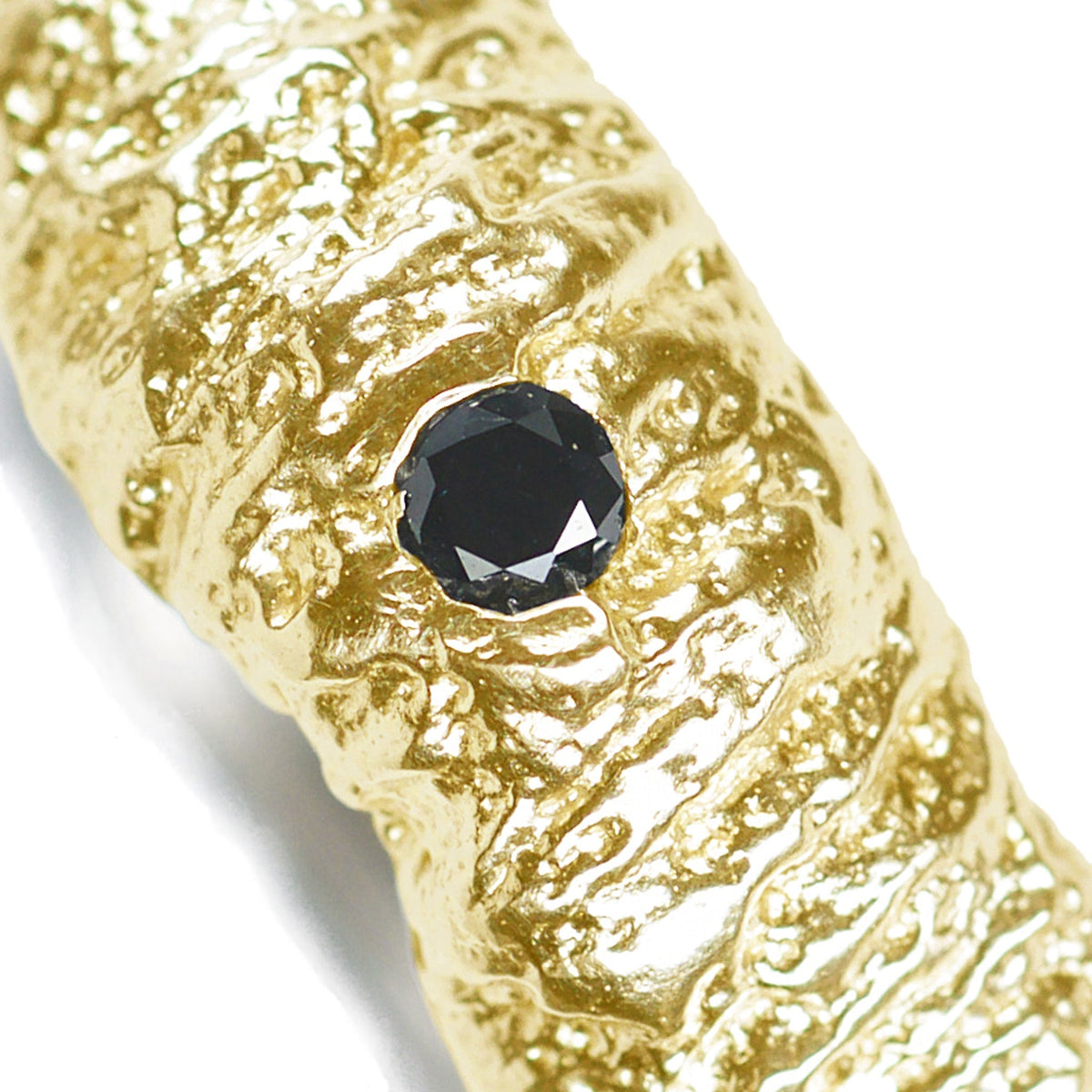 The tree trunk inprint wedding band in 14k and 18k white and yellow gold with a black diamond
