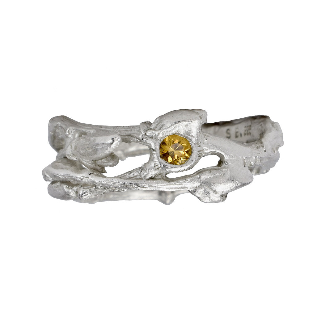 the twig ring made in silver with a yellow sapphire