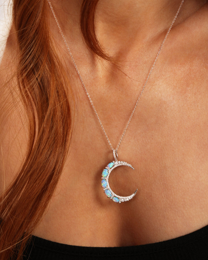she-is-an-icon-moon-necklace-in-silver-and-blue-opal