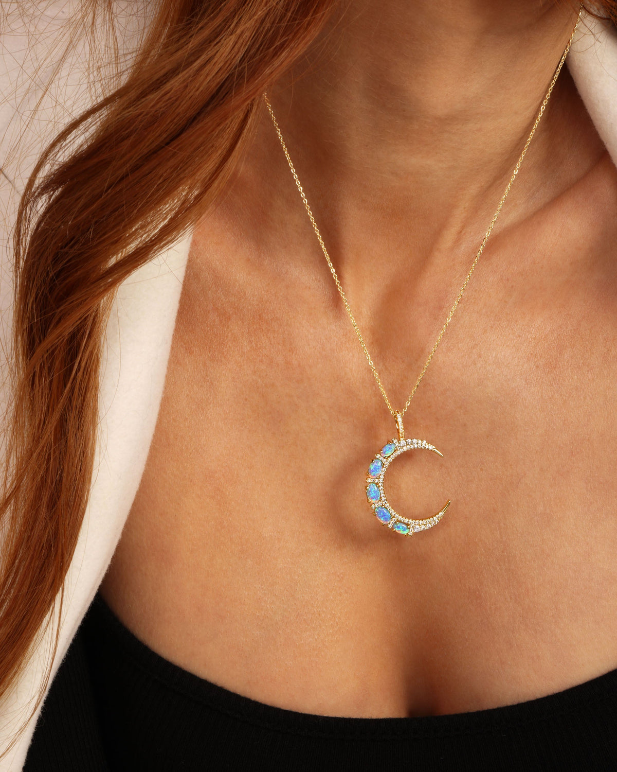 she-is-an-icon-moon-necklace-in-gold-and-blue-opal