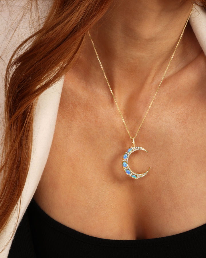 she-is-an-icon-moon-necklace-in-gold-and-blue-opal