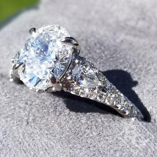 Oval Hidden Halo Diamond Engagement Ring with Pear Cut Sides
