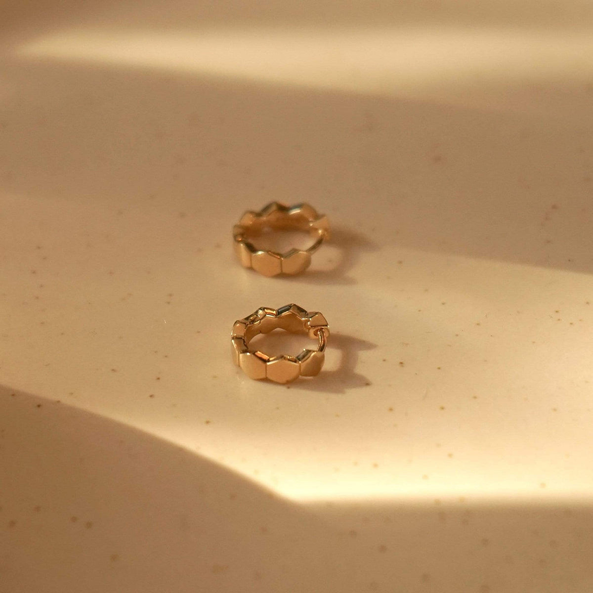 hexagon-huggie-hoop-earrings-18ct-gold-plated-daisy-london
