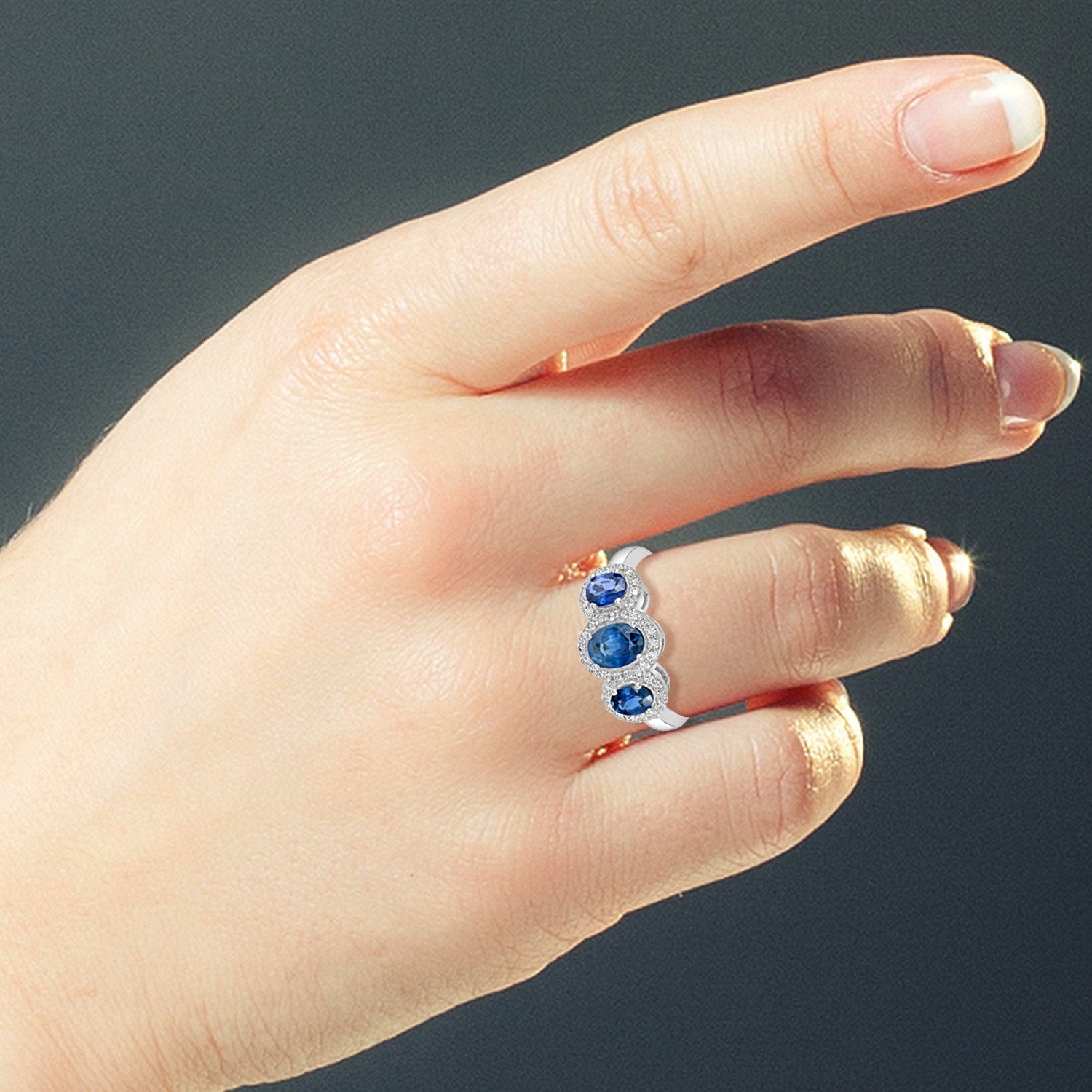 Triple Blue Sapphire And Diamond Halo Ring In 18K White Gold