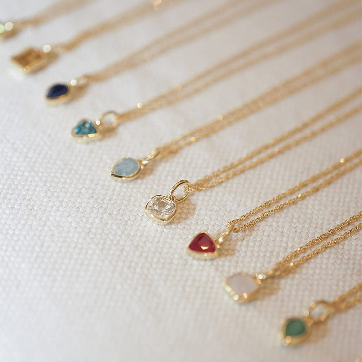 blue-topaz-december-birthstone-charm-necklace-18ct-gold-plated-daisy-london