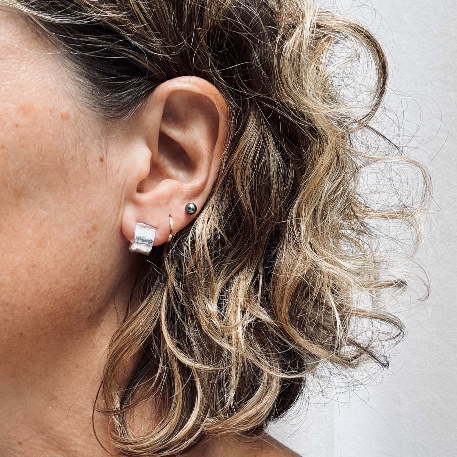 Brutalist Circular Huggie In Silver