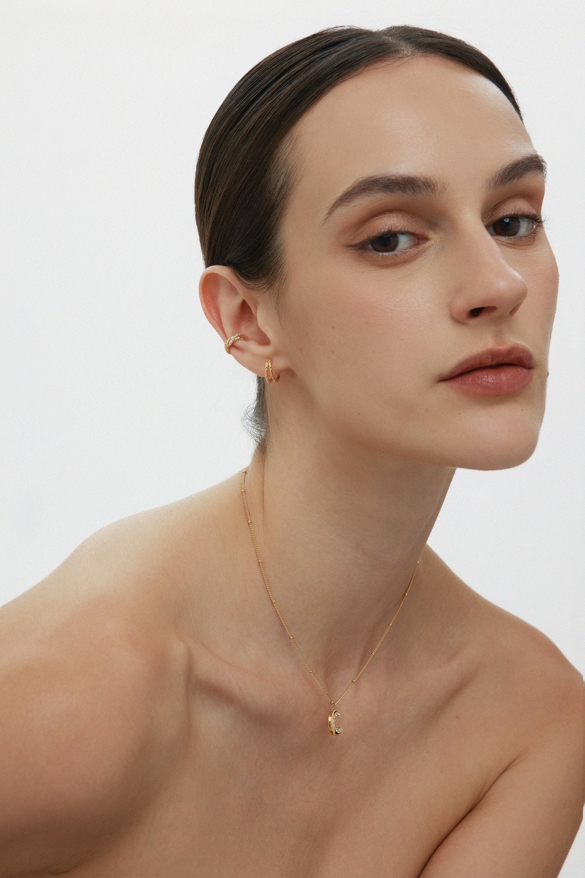 Vera Twisted Crystal Ear Cuff In Gold