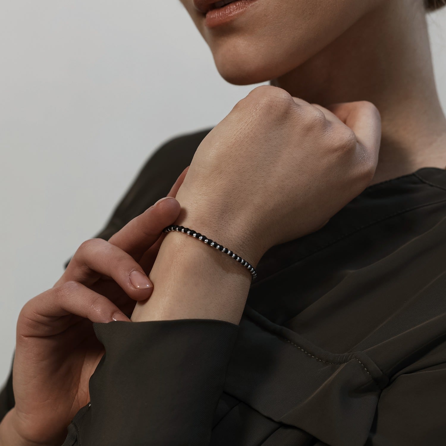 Delicate Handmade Black Friendship Bracelet With Tiny Silver Beads - Spitafields