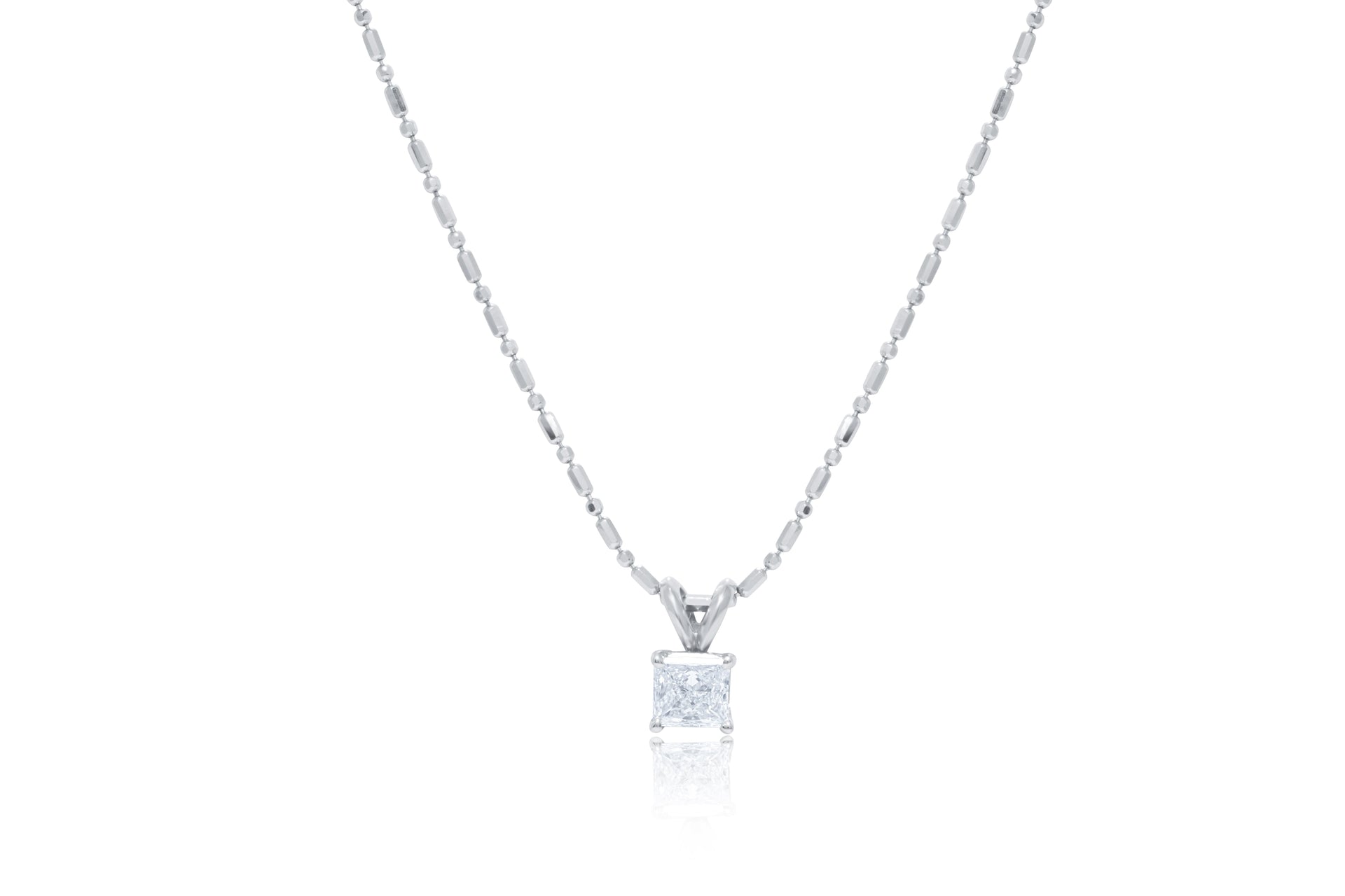 14kt white gold solitaire diamond pendant featuring 0.63 ct clarity enhanced radiant cut diamond