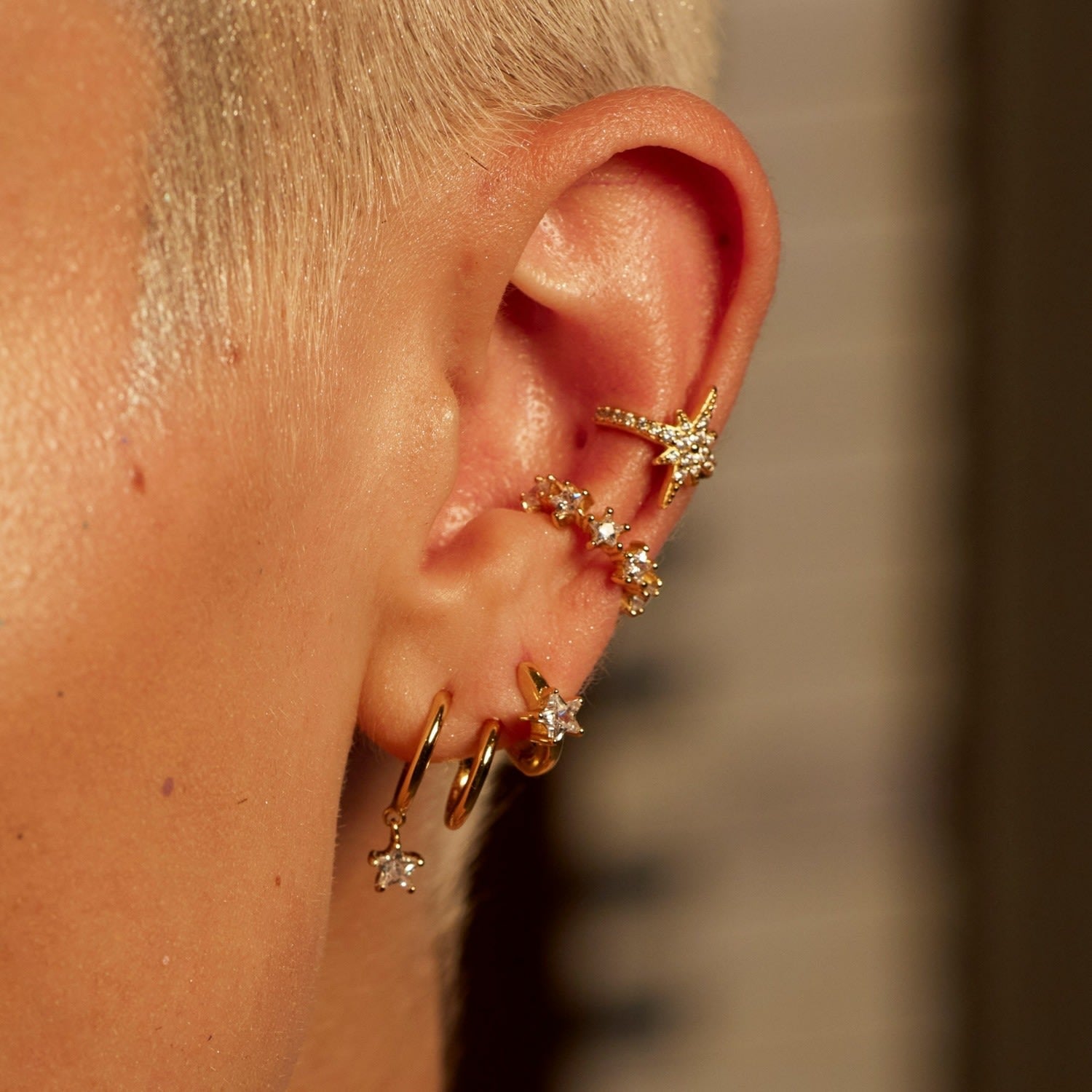 Gold Illusion Hoop Earrings With Sparkling Star Drop