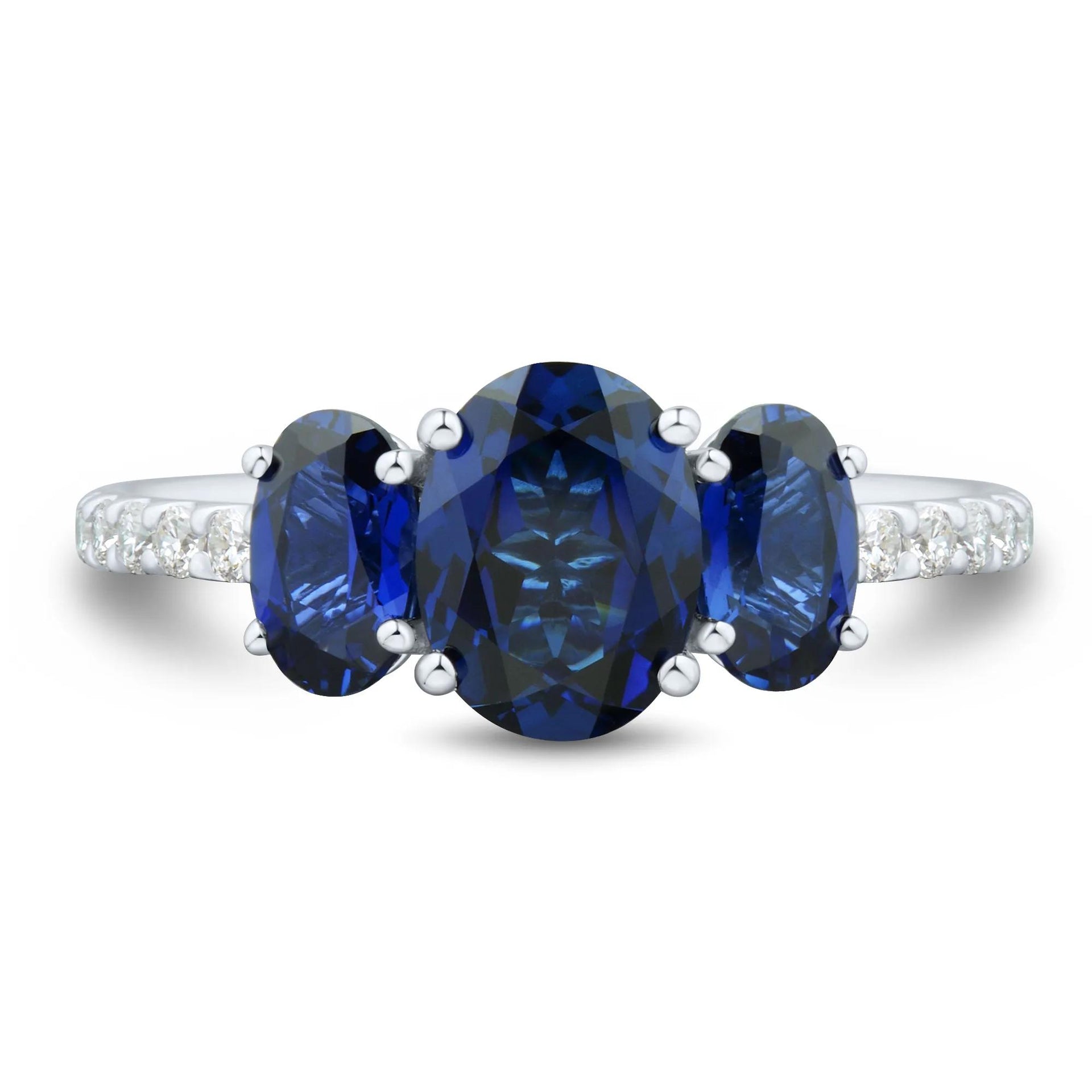 1/5 CT. Tw. Lab-Created Blue Sapphire and Lab Grown Diamond Three-Stone Ring 10K White Gold Size 7 1mm
