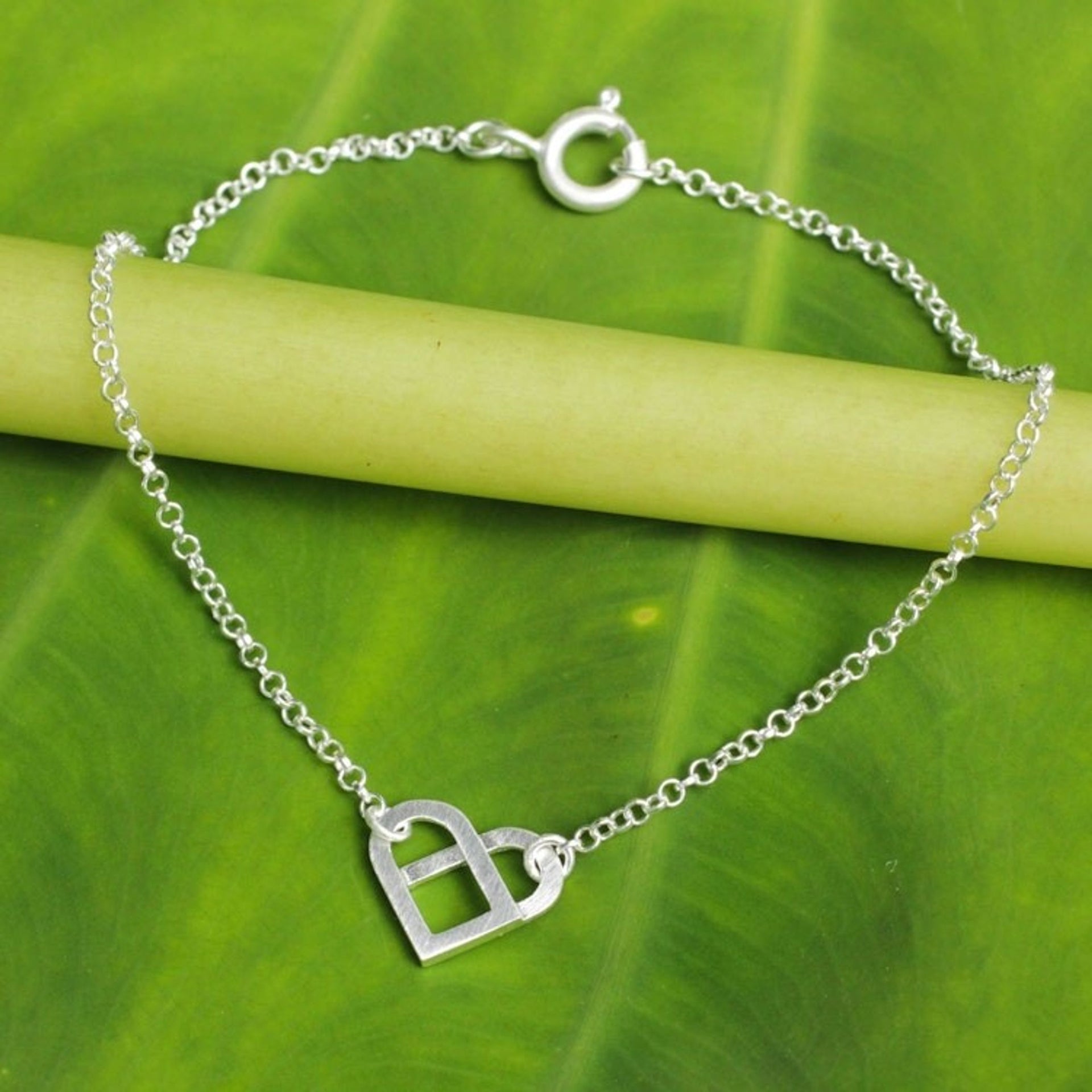 Unique Brushed Sterling Silver Heart Pendant Bracelet 'Loving Knot'