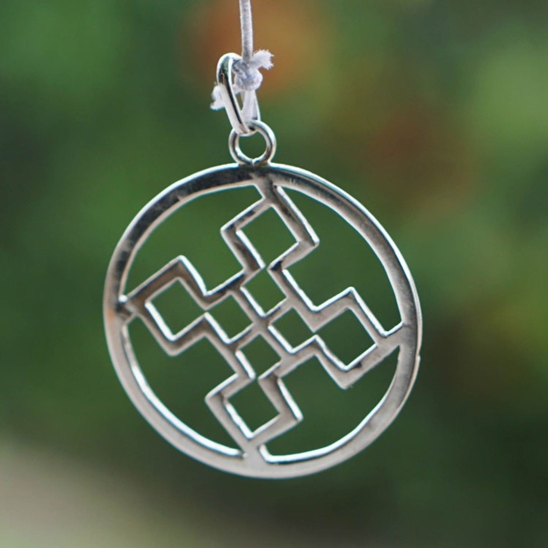 Sterling Silver Round Pendant with Geometric Icon from Ghana 'Authentic Core'