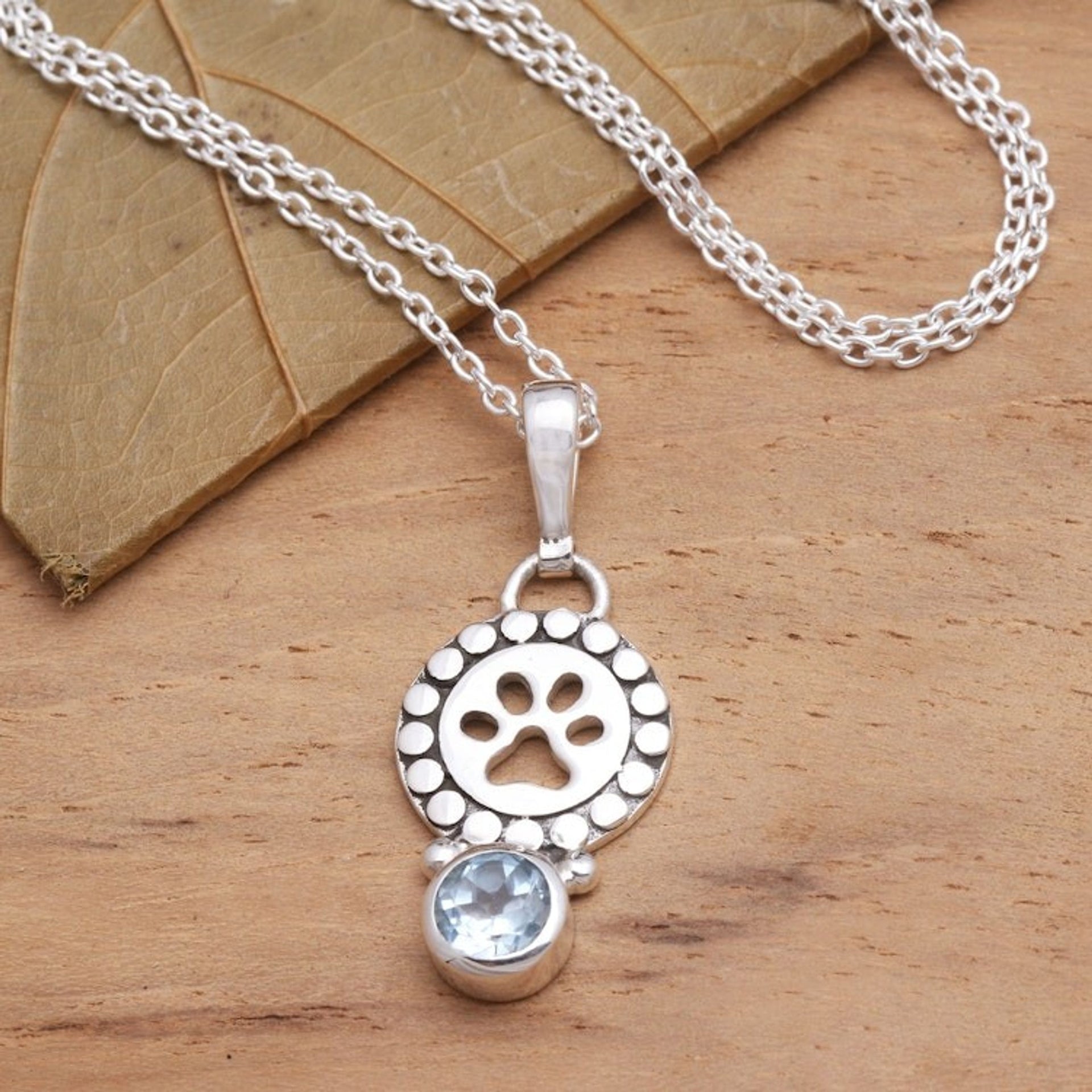 18-Inch Necklace with Faceted Blue Topaz Pawprint Pedant 'Pawprint Memory'