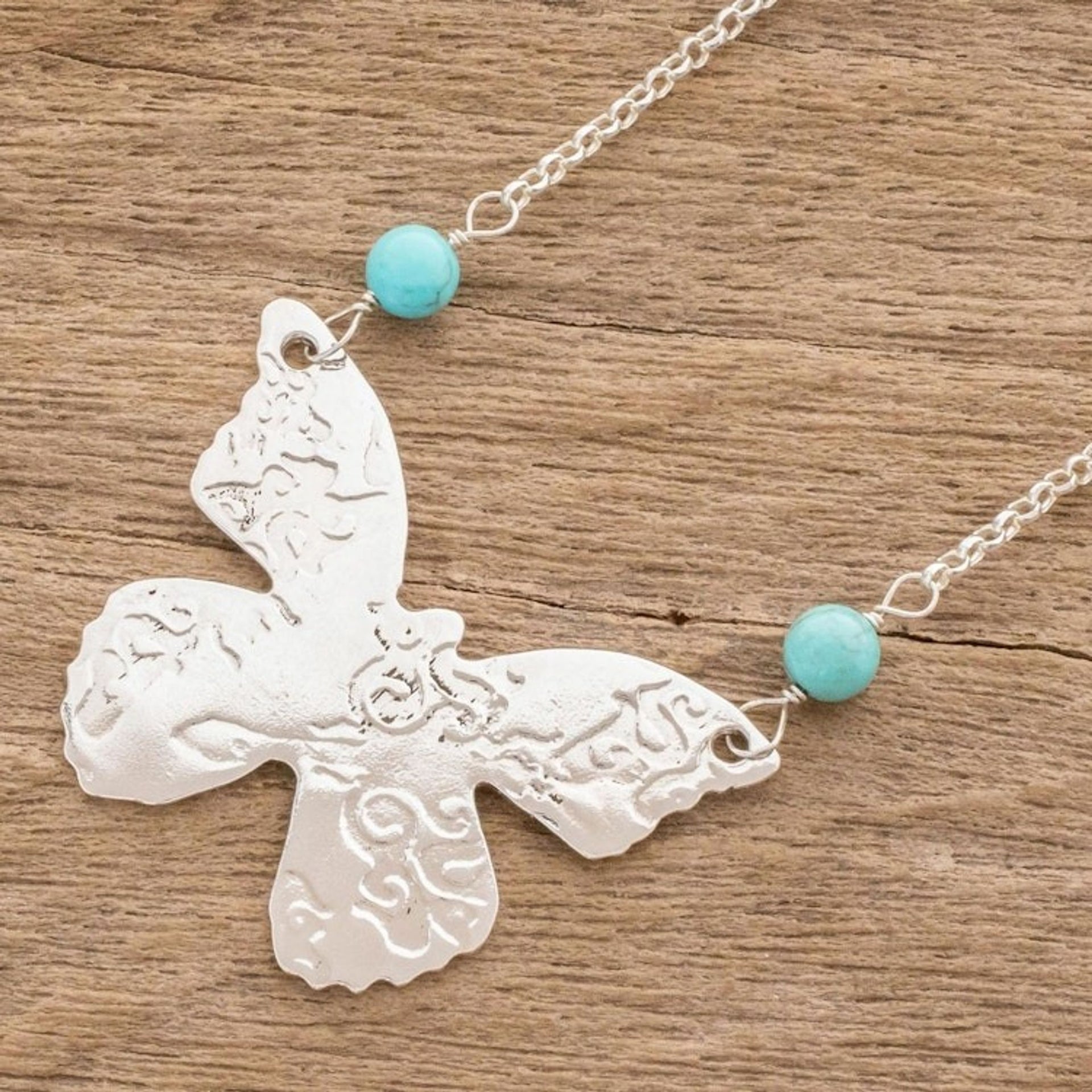 Sterling Silver and Recon. Turquoise Pendant Necklace 'Butterfly Texture'