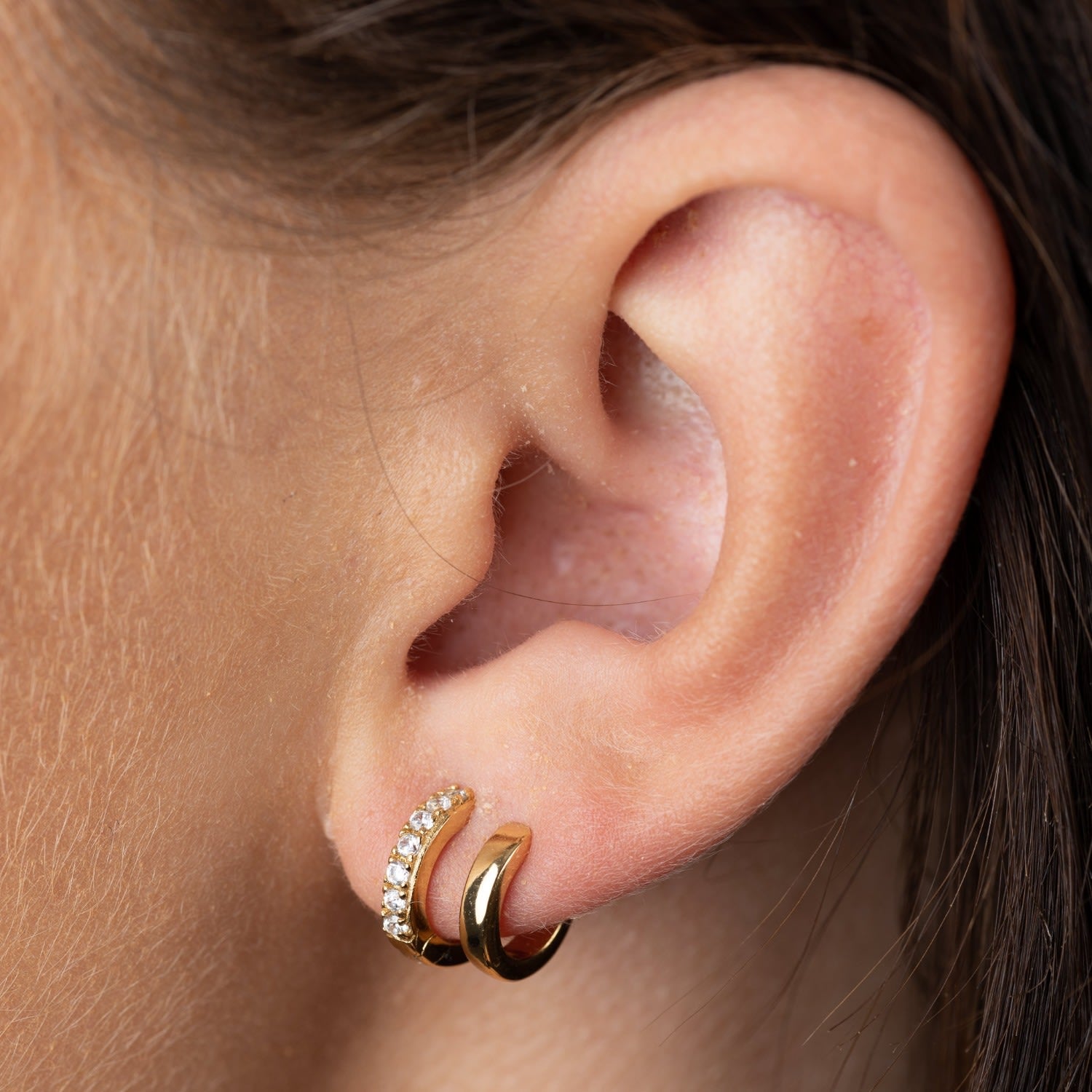 Gold Mismatched Double Huggie Earrings With Clear Stones