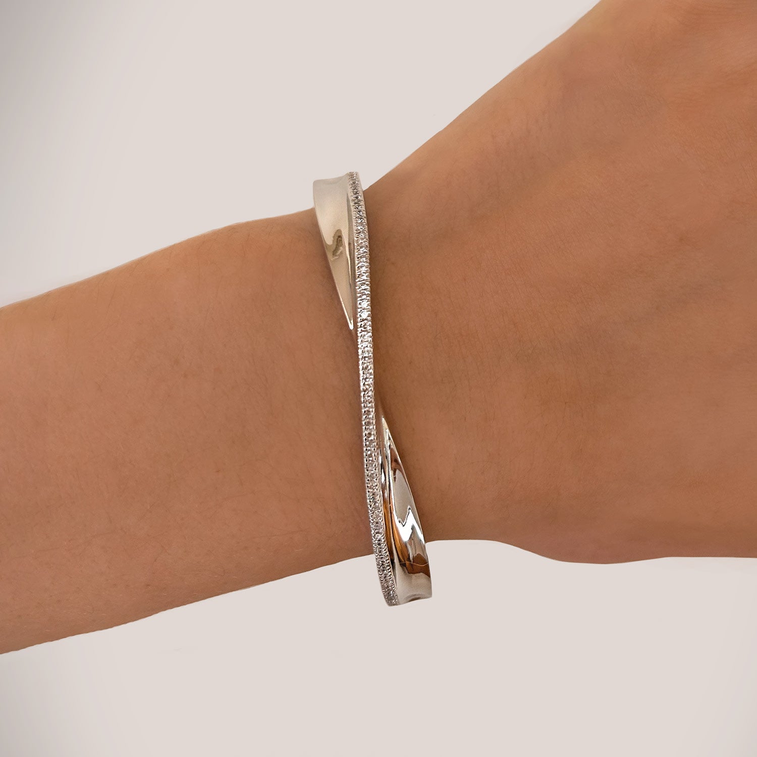 Light Bangle With Man Made White Cz Diamond Stimulant In Sterling Silver