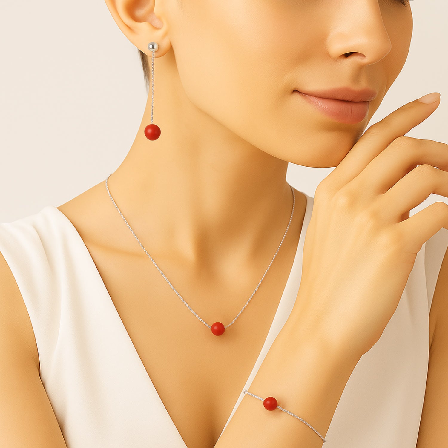 Minimal Dangling Earrings In Sterling Silver With Natural Coral Bead