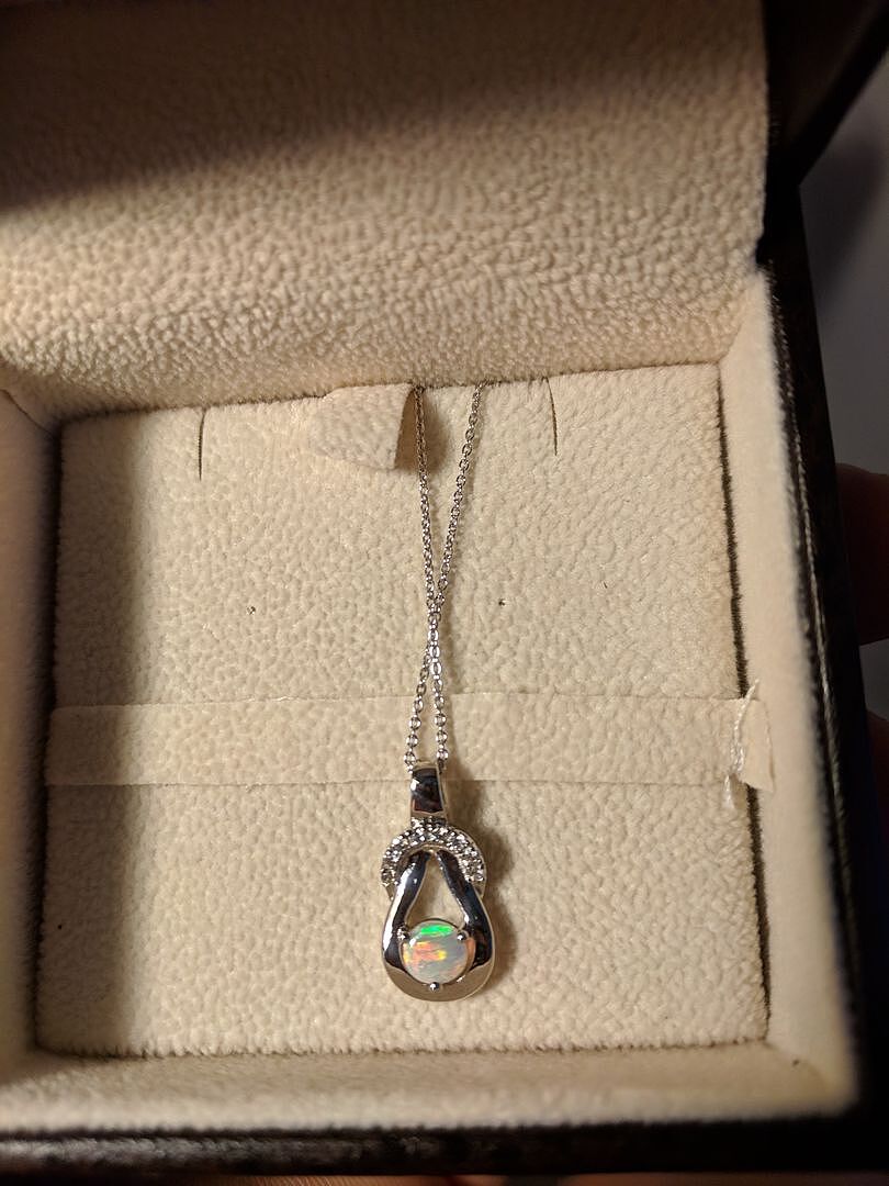 Peridot Infinity Knot Pendant with Diamonds