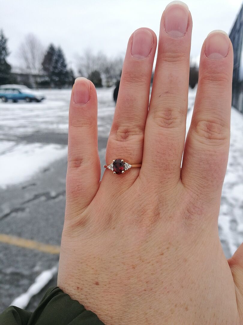 Solitaire Oval Garnet Ring with Trio Diamond Accents