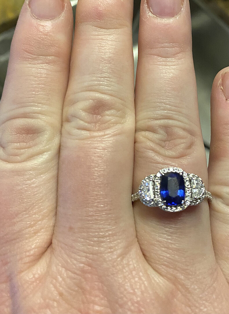 Cushion Blue Sapphire and Half Moon Diamond Halo Ring