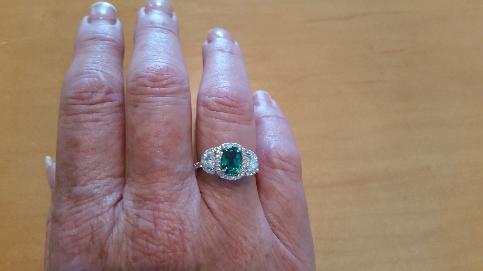 Cushion Emerald and Half Moon Diamond Halo Ring