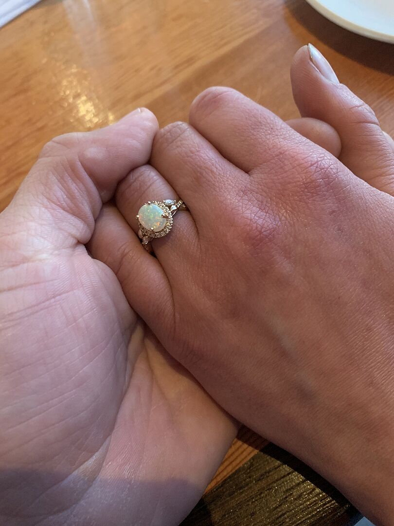 Oval Emerald Twisted Vine Ring with Diamond Halo