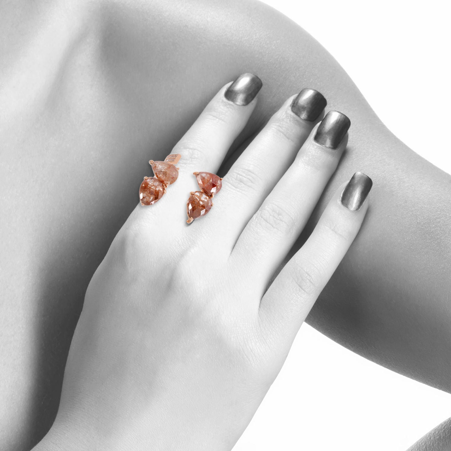 Pear Cut Ice Diamond In Rose Gold Between The Finger Ring