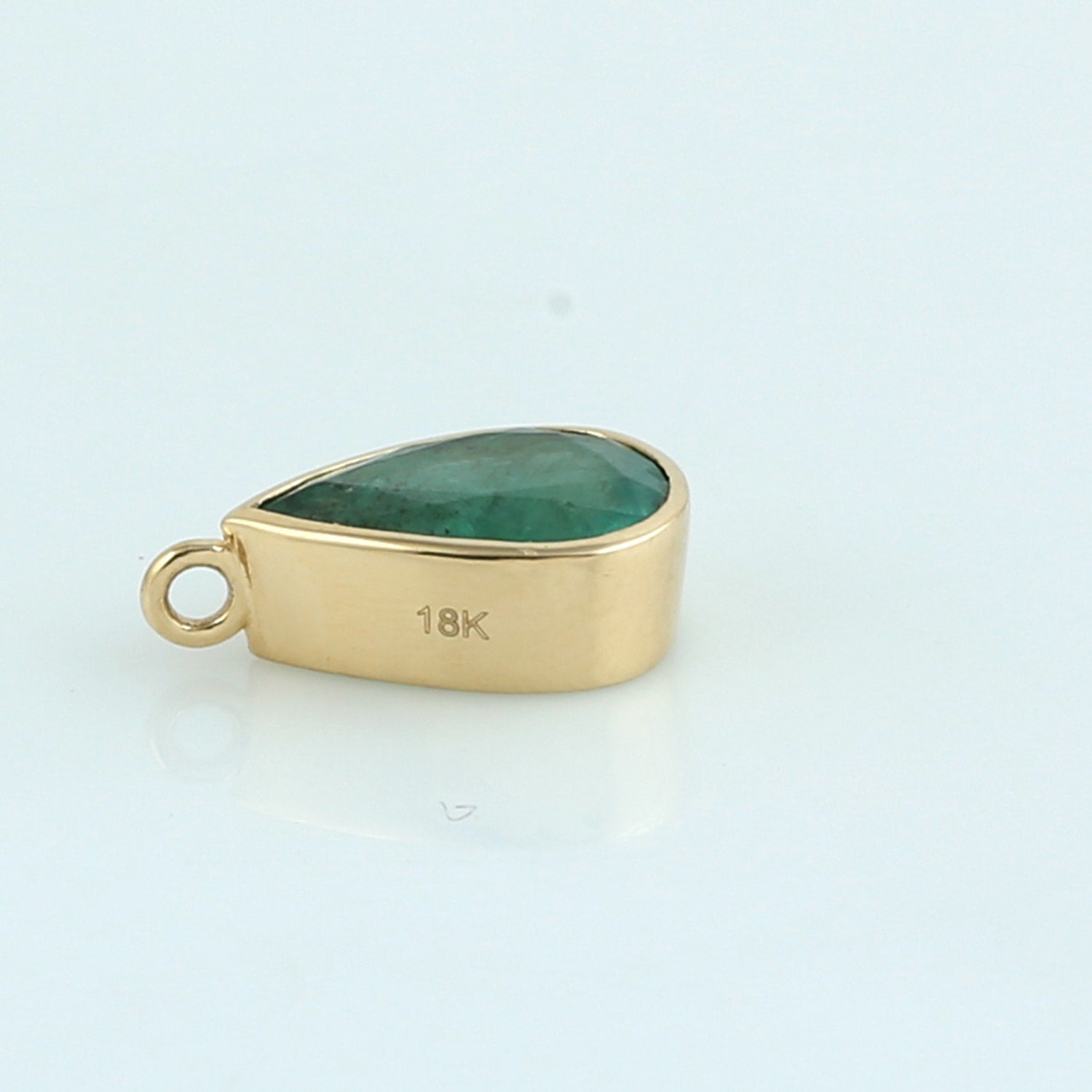 Pear Shape Emerald Bezel Set Pendant In 18K Yellow Gold