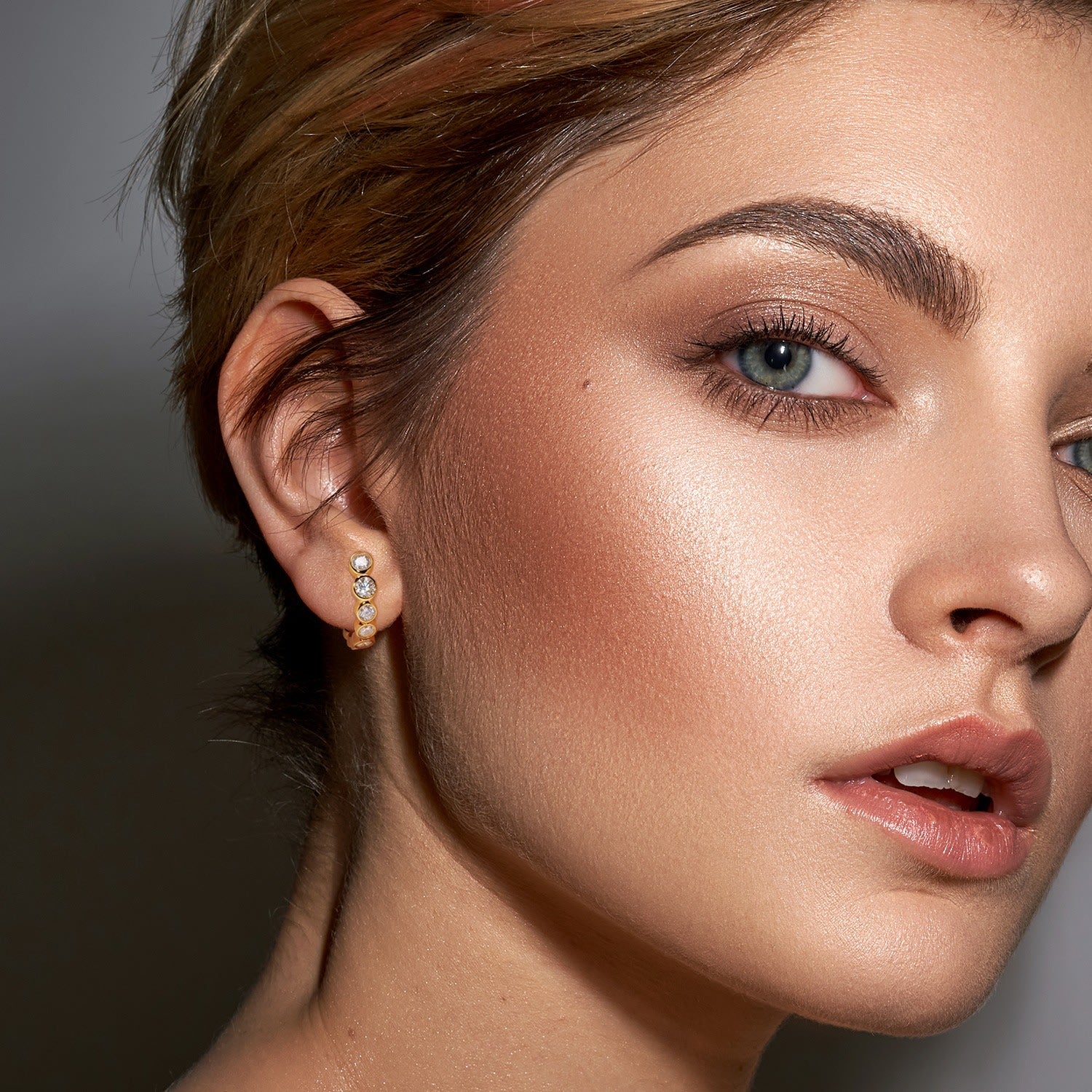 Graduated Bezel Set Cz Huggie Earrings - Gold