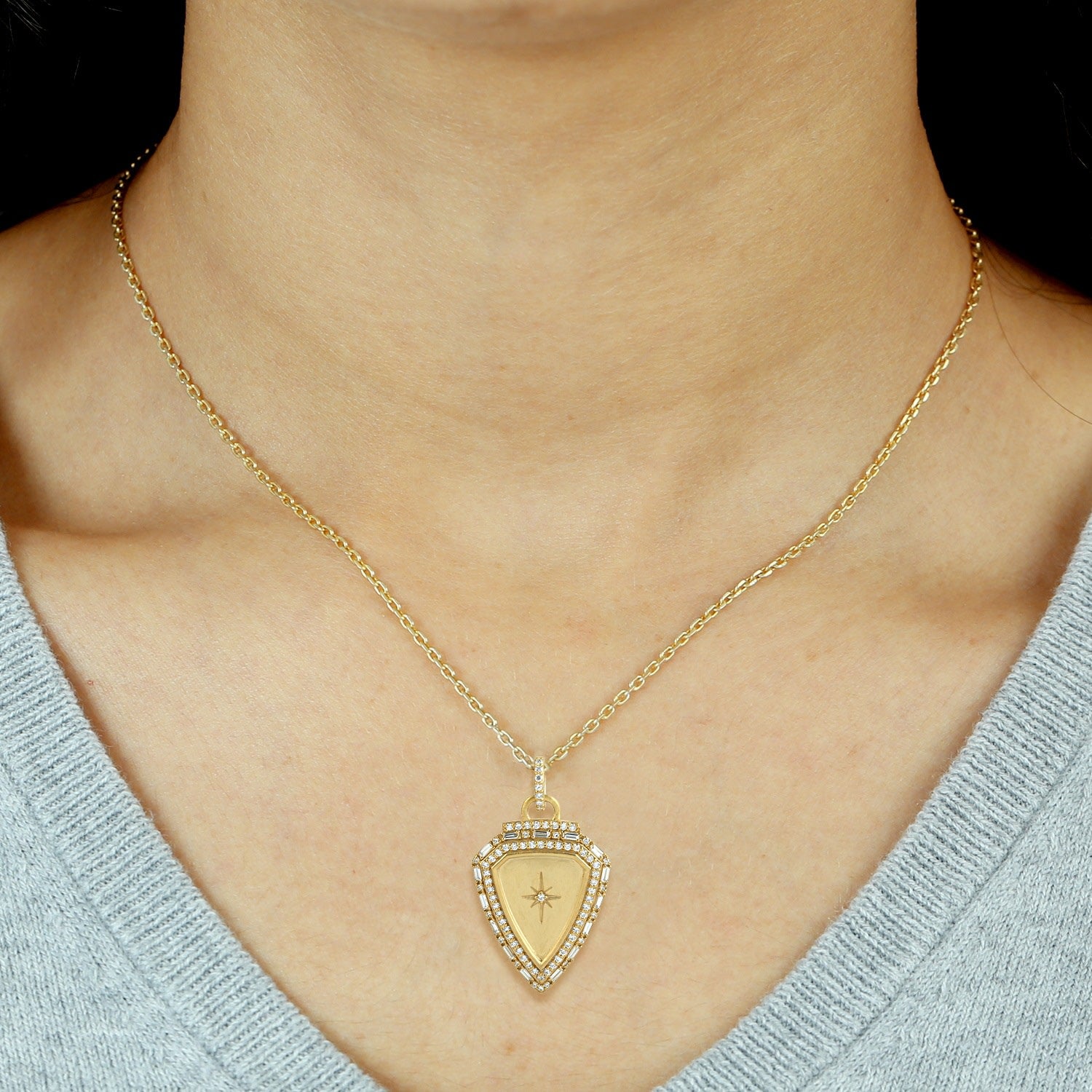 Shield Shaped Baguette Diamond Starburst Pendant In 18K Yellow Gold
