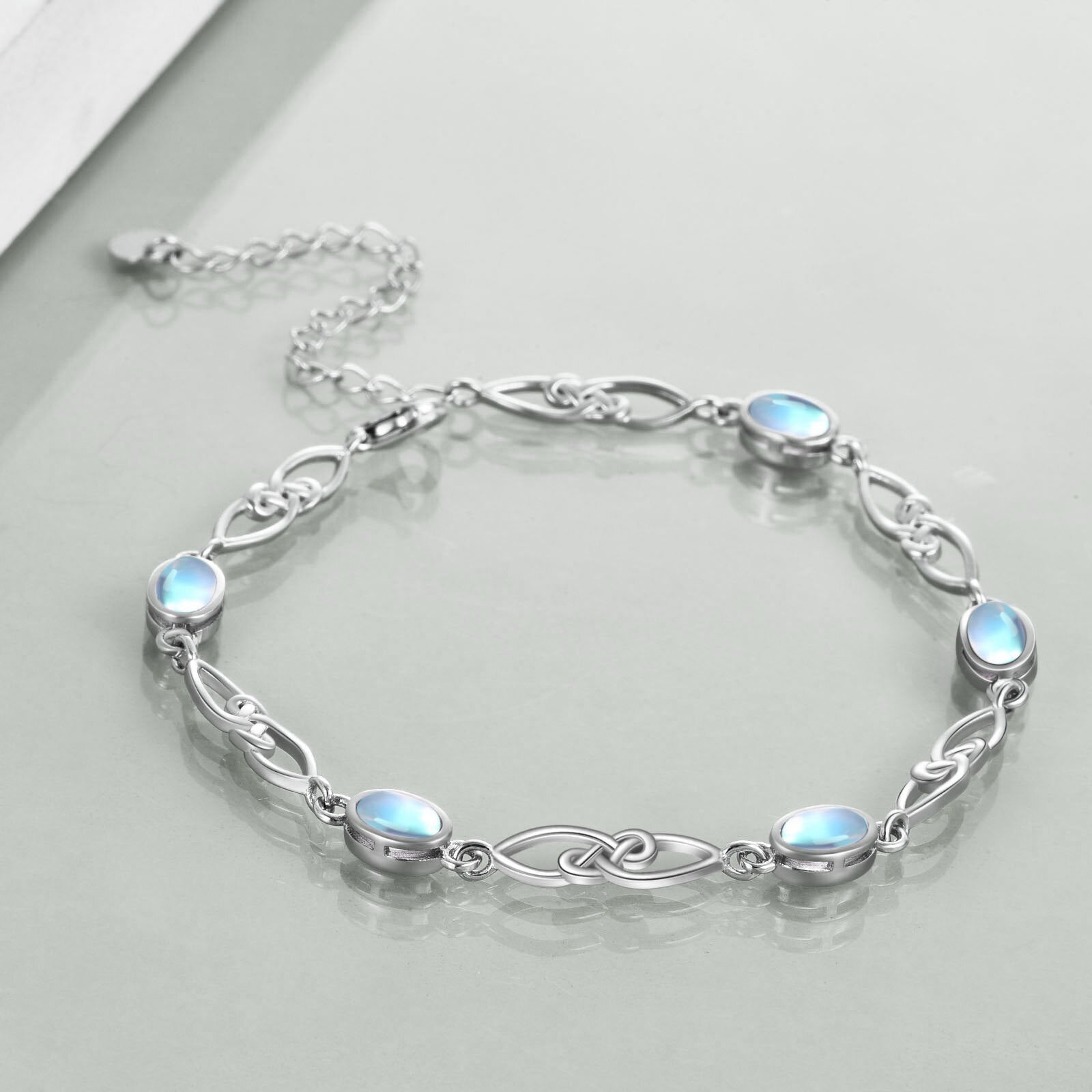 Sterling Silver Oval Shaped Moonstone Celtic Knot Charm Bracelet