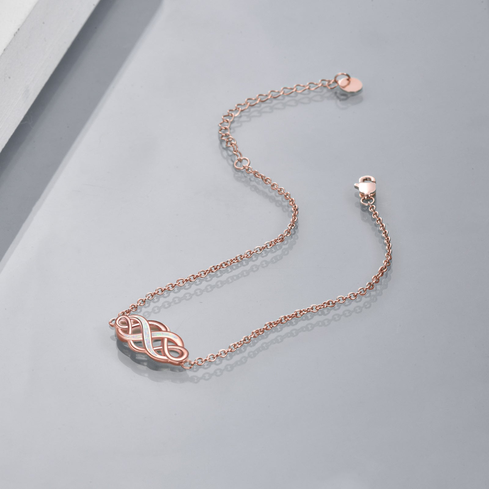 Sterling Silver with Rose Gold Plated Opal Celtic Knot Charm Bracelet