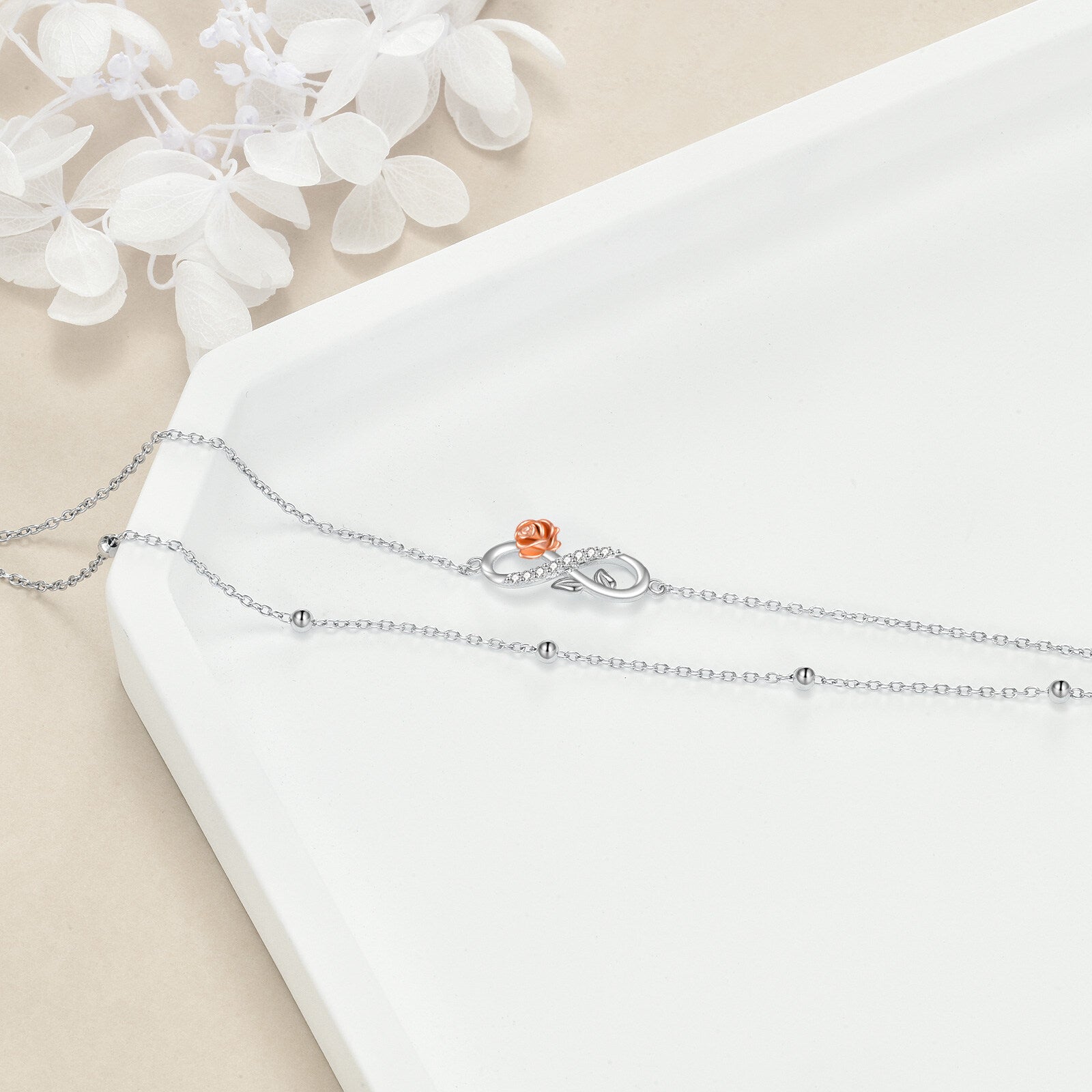 Sterling Silver Two-tone Circular Shaped Cubic Zirconia Rose & Infinity Symbol Layerered Bracelet
