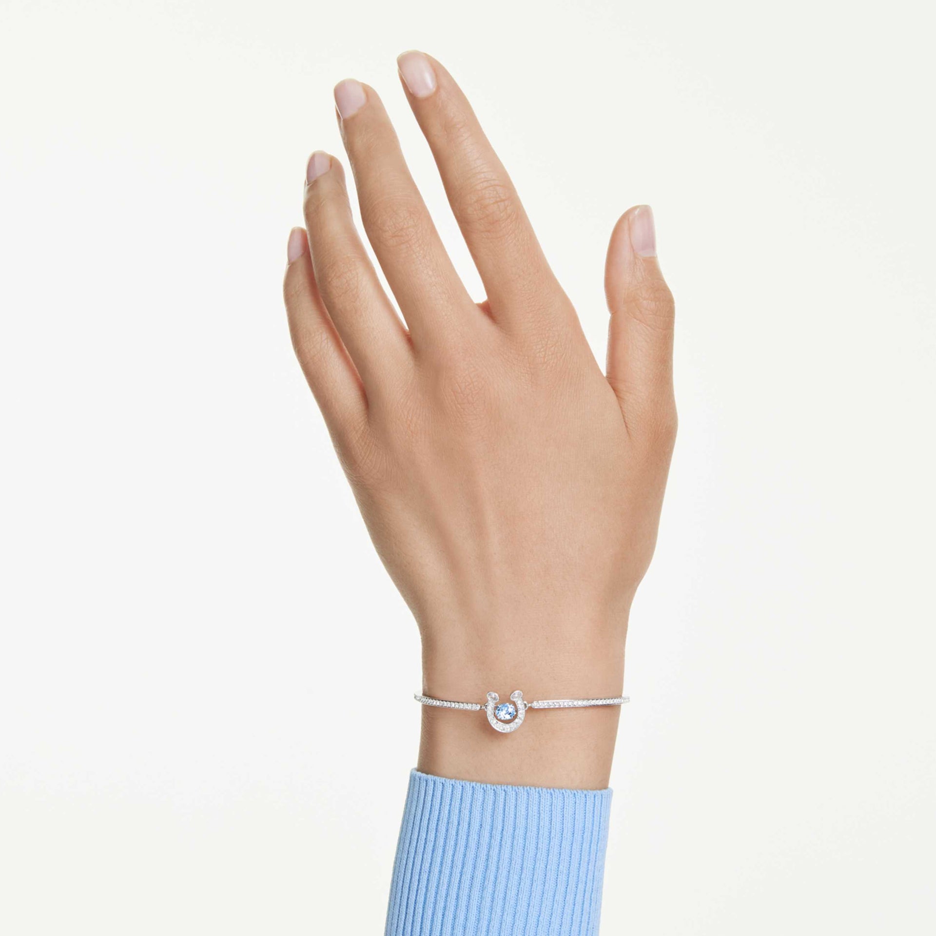 SYMBOLICA BANGLE ROUND CUT PAVE HORSE SHOE BLUE RHODIUM PLATED