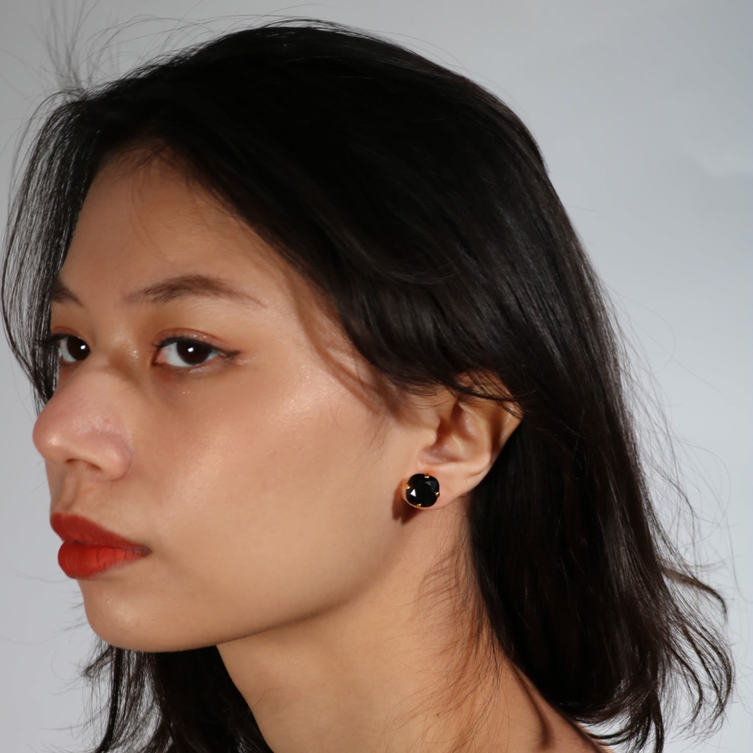 The Large Black Stud In Gold