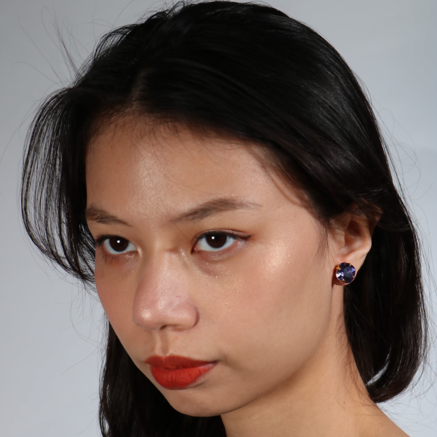 The Large Purple Stud In Gold