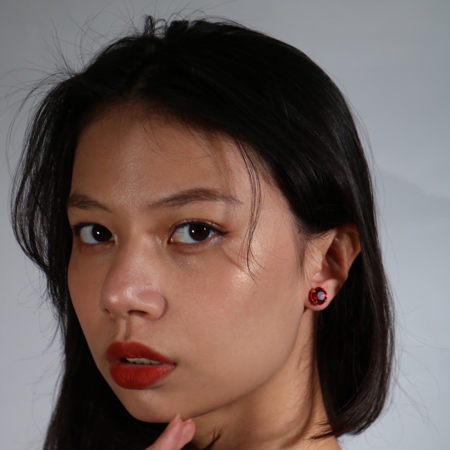The Large Red Stud In Gold