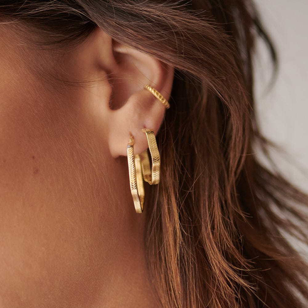 wavy-snake-hoop-earrings-18ct-gold-plated-daisy-london