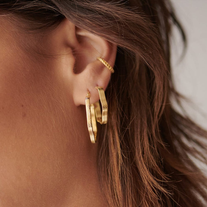wavy-snake-hoop-earrings-18ct-gold-plated-daisy-london