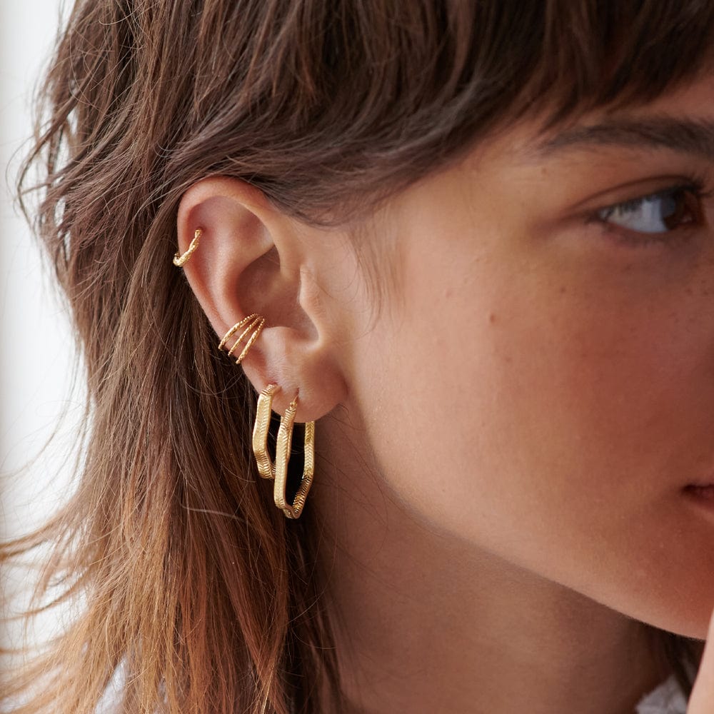 wavy-snake-hoop-earrings-18ct-gold-plated-daisy-london