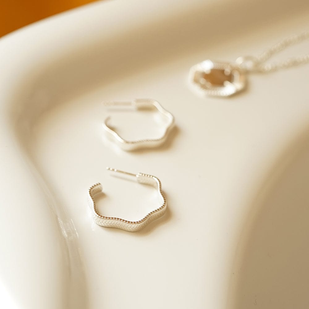 wavy-snake-hoop-earrings-sterling-silver-daisy-london