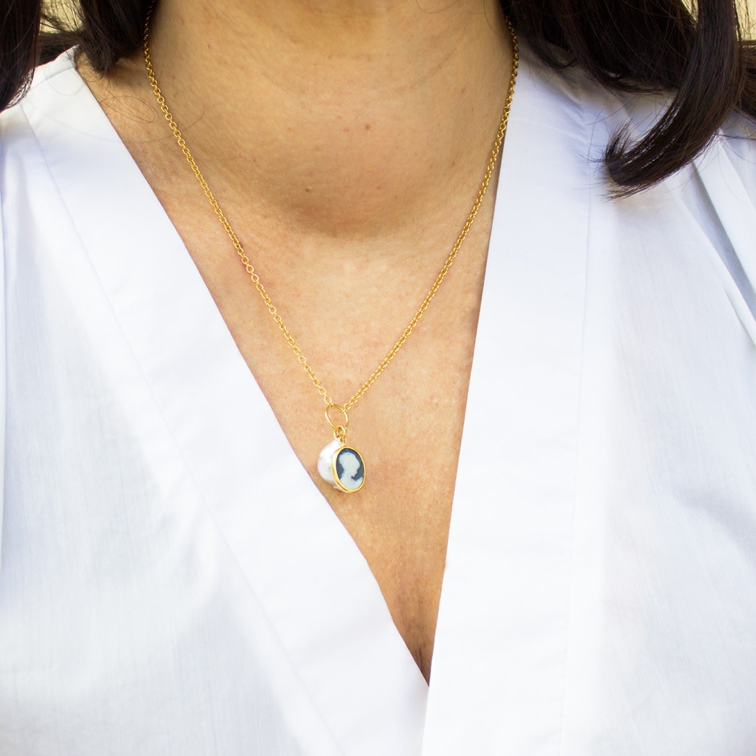 Black Cameo With A Pearl Necklace